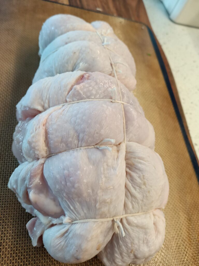 photo of a trussed uncooked piece of poultry