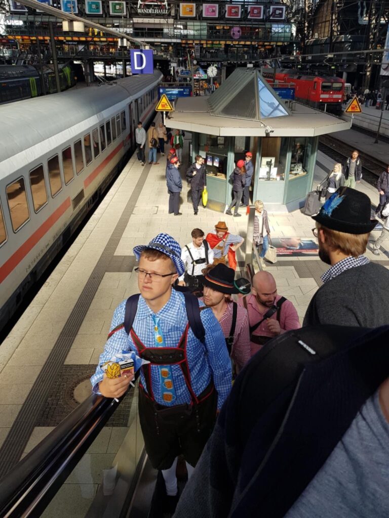 photo of a station in Germany with people in Oktoberfest clothing