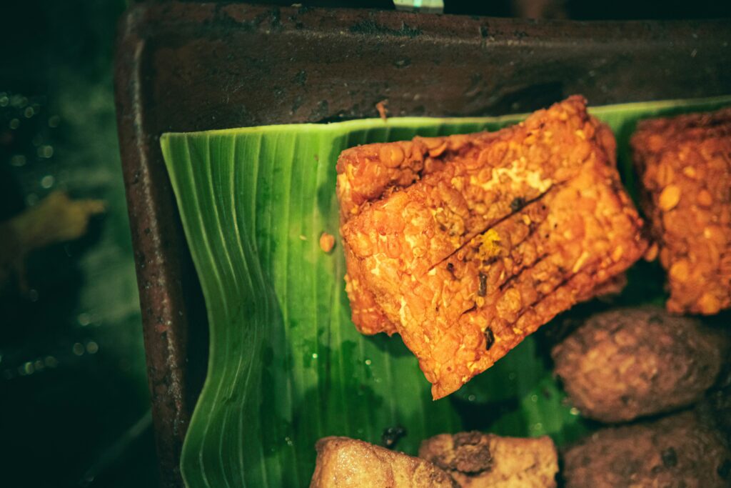 photo of dark brown food product against a green leaf