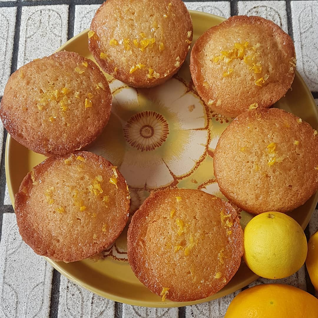 photo of 6 small round cakes on a yellow plate