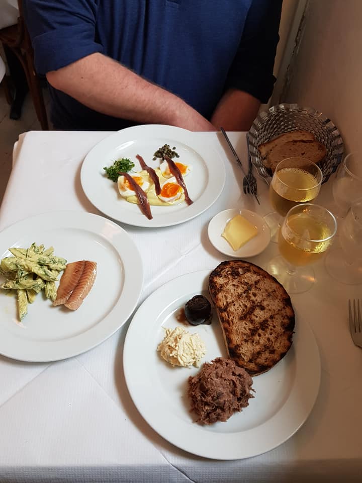 photo of a meal with a white tablecloth