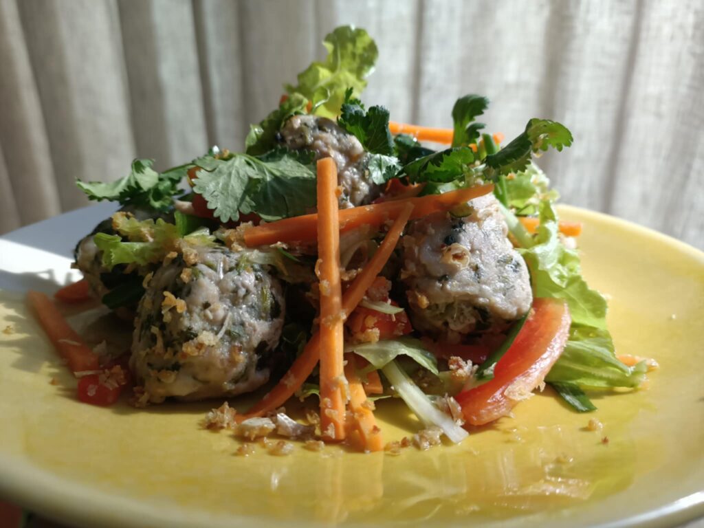 photo of a colourful salad on a yellow plate