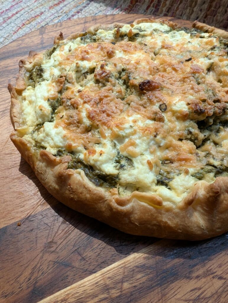 photo of a pastry open face tart with spinach and cheese